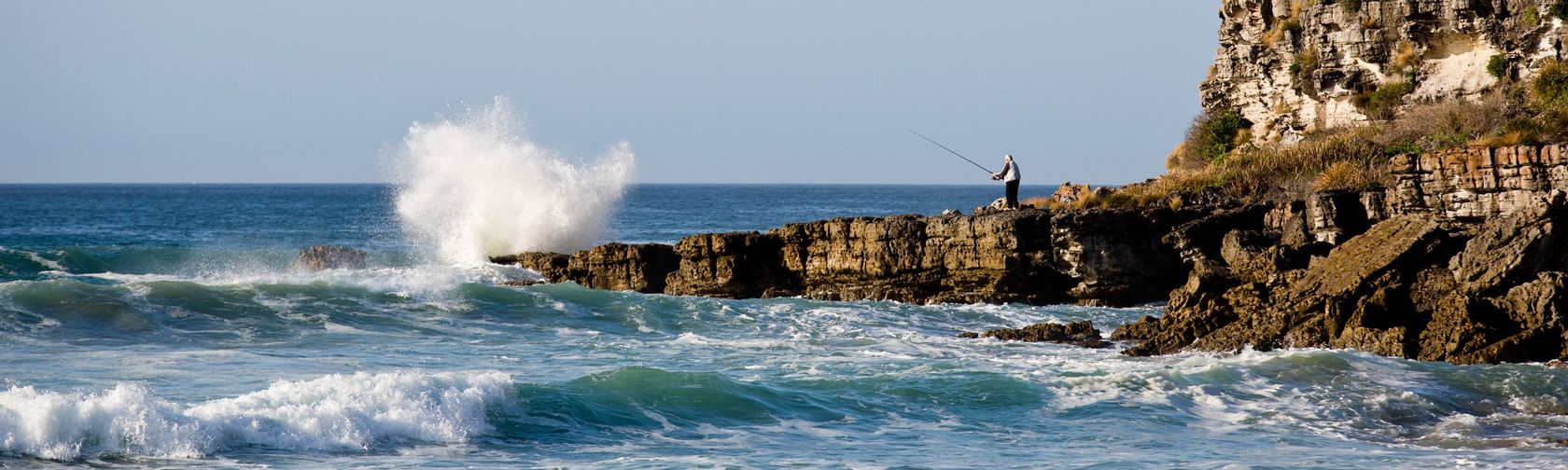 Fishing from the rocks at Cave Beach